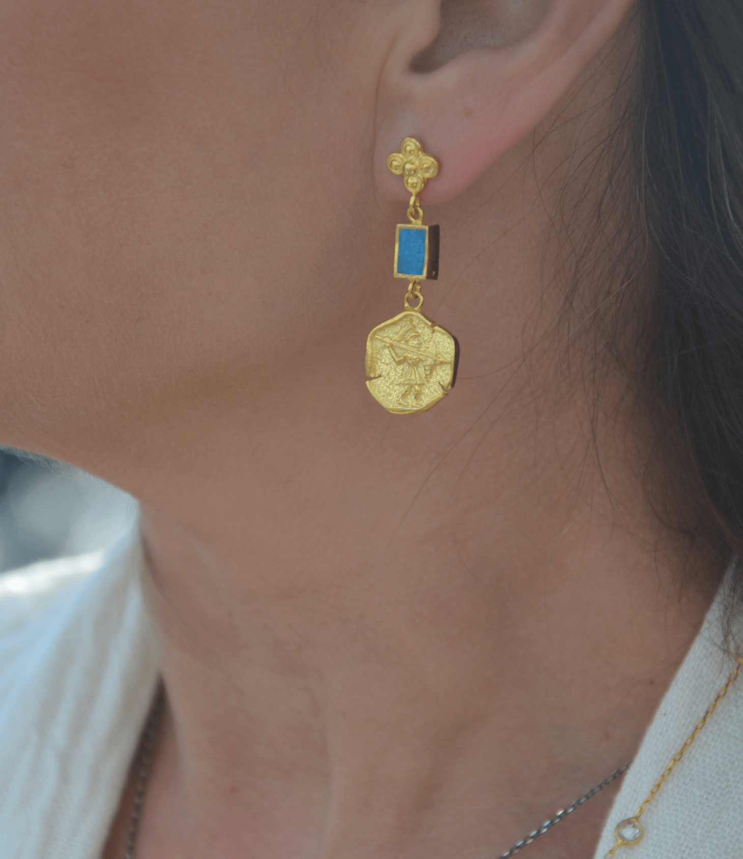 Gold Disc and Turquoise earrings elegantly worn, showcasing intricate design and luxurious beauty.