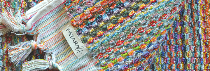 Colorful Turkish bath towels featuring vibrant patterns and tassels, showcasing soft texture and quality craftsmanship.