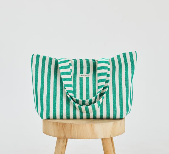 Green and White Striped Beach Tote Bag on stool