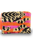 Colorful pouch with leopard print pattern on a white background