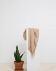 Stonewash Turkish Towel hanging over pedestal