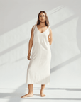 Soft cotton dress with tied straps, showcasing elegant design and breathable fabric for comfortable wear.