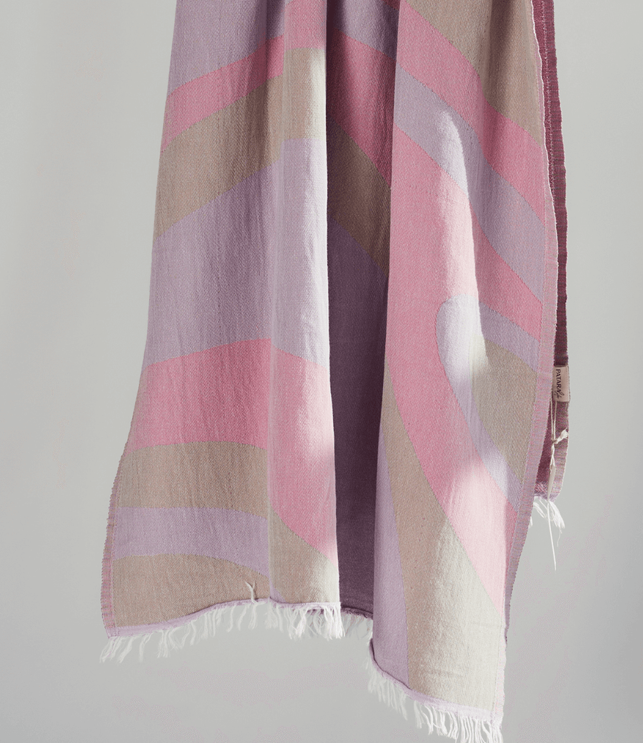 Turkish Beach Towel featuring a dynamic abstract wave design in pastel shades, perfect for beach days and quick drying.