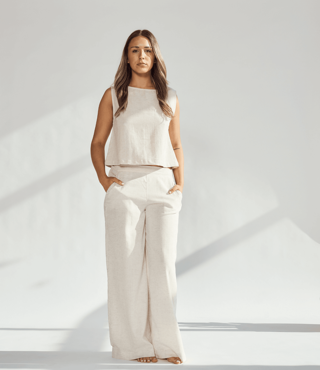 Model showcasing a Linen Wide Leg & Crop Top Set in a neutral tone, highlighting comfort and sophistication.