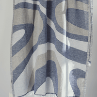 Turkish Beach Towel featuring dynamic blue and beige wave design, made from quick-drying Turkish Cotton, perfect for beach use.