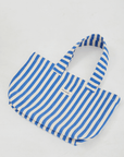 Blue stripe beach tote bag layed flat on floor