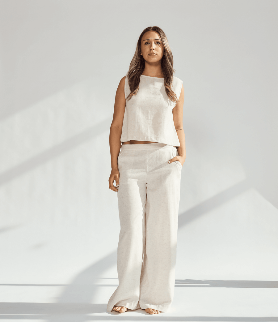 Model wearing a beige linen wide leg and crop top set, highlighting comfort and sophistication in fashion.