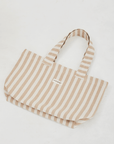 Herringbone woven linen tote bag in Light Brown stripe layed flat on floor