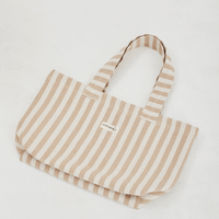 Herringbone woven linen tote bag in Light Brown stripe layed flat on floor