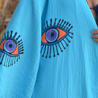 Evil Eye Kaftan Robe in turquoise featuring hand-painted eye designs, perfect for stylish loungewear or beachwear.