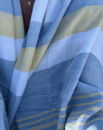 A lightweight peshtemal towel wrapped as a shawl