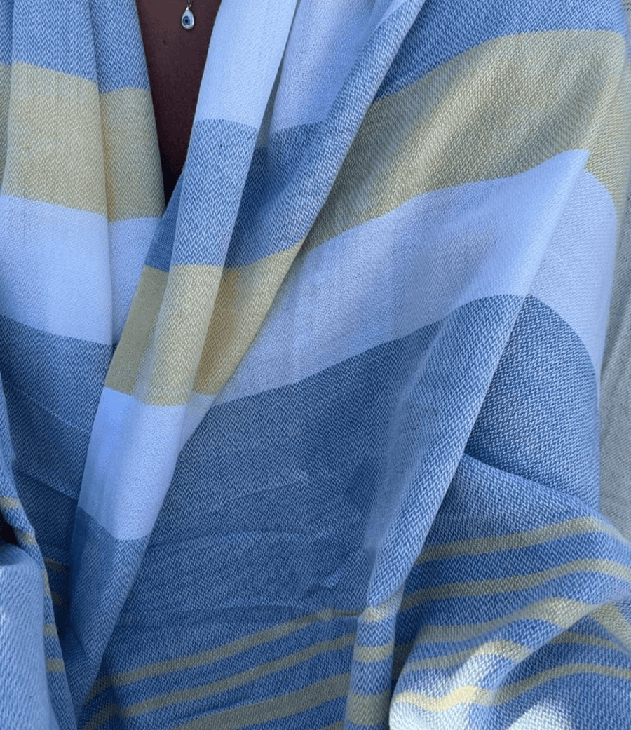 A lightweight peshtemal towel wrapped as a shawl