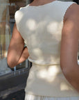 Back view of a woman wearing the Kastamonu Soft Layer Top – Ribbed in a soft cream color, showcasing the ribbed texture.