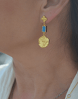 Gold Disc and Turquoise earrings elegantly worn, showcasing intricate design and luxurious beauty.