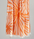 Radiance Turkish Beach Towel showcasing a sunburst pattern in golden yellow and soft orange, made from organic cotton.