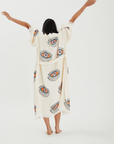 Back view of a woman in an Evil Eye Robe, showcasing its handpainted design and relaxed kimono style.