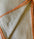 Textile with geometric pattern and orange border