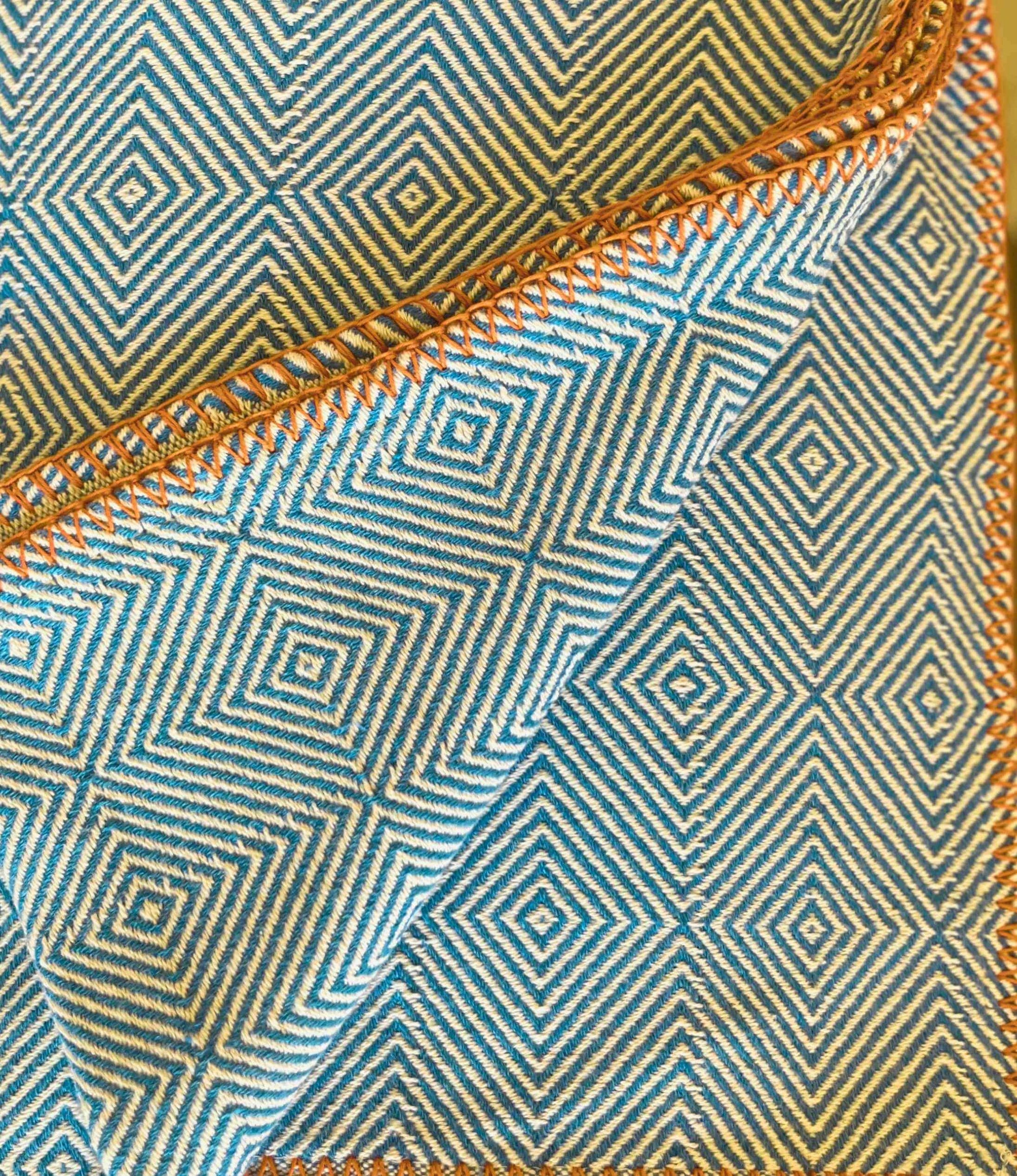 Close-up of fabric with blue and beige geometric pattern