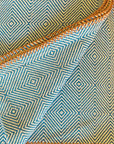 Close-up of fabric with blue and beige geometric pattern
