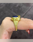 Side view of the Saphira Amethyst Statement Ring showing its raised setting and textured gold-tone band
