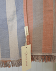 Striped fabric with a brand tag on a light background