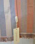 Striped fabric with a brand tag on a light background