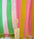 Striped fabric with green, pink, and yellow colors and a brand tag.