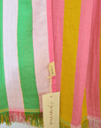 Colorful striped fabric with a brand tag on a white background