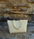 yellow beach tote bag on a beach rock cliff