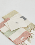 "Patara" Peshtemal in Green & Navy and Green & Red layed flat next to each other