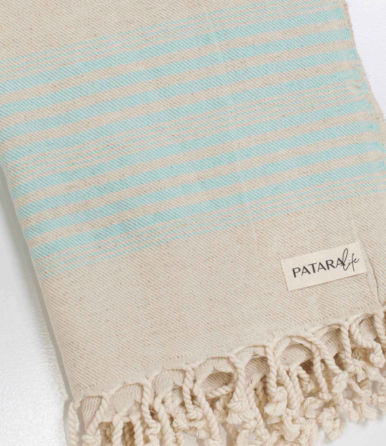 Kas Linen/Cotton peshtemal with blue stripes and tassels, perfect for beach days and picnics.