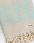 Kas Linen/Cotton peshtemal with blue stripes and tassels, perfect for beach days and picnics.