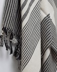 A premium linen "Kekova" Turkish towel in Black & Beige stripe