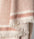 A dotted Turkish cotton "Kalkan" beach towel in copper red